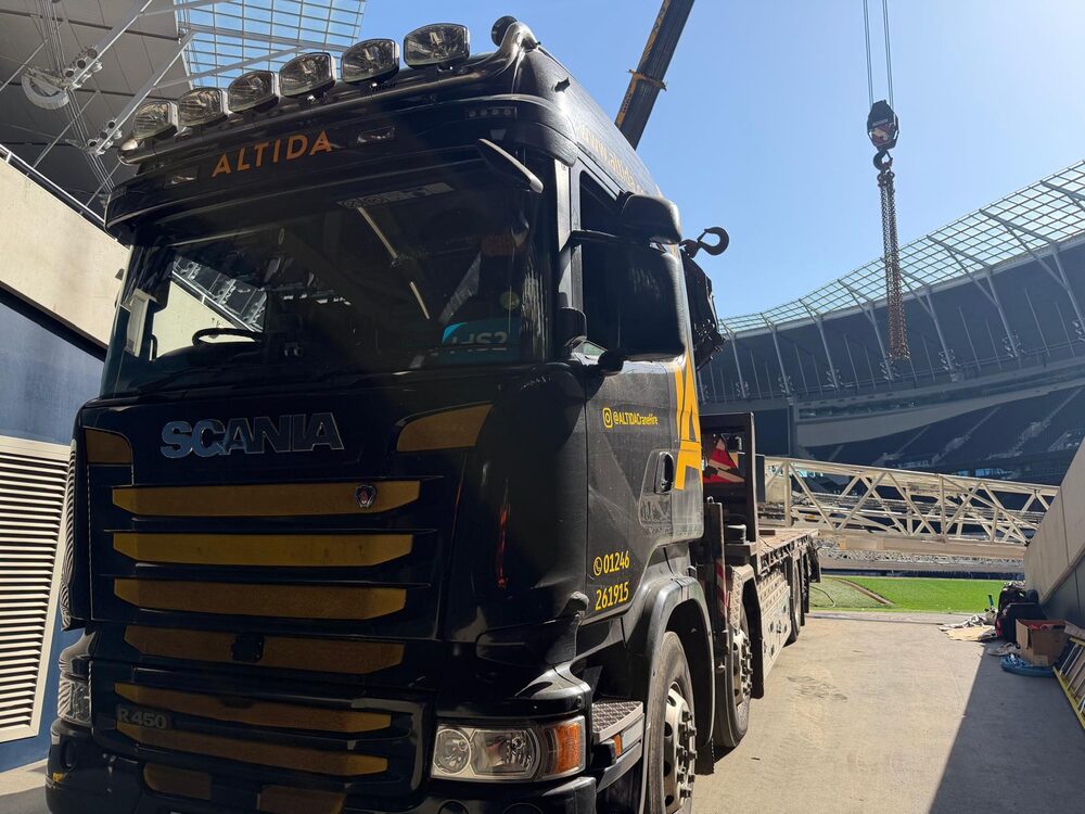 Altida's branded Scania artic on the pitch at Tottenham Hotspur Stadium beneath a city crane